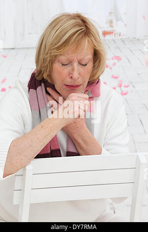Elderly person coughing Stock Photo
