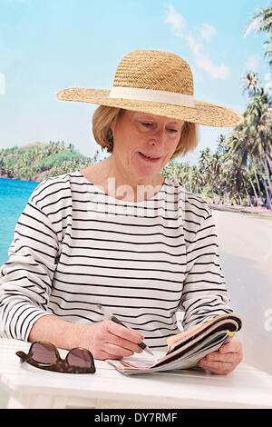 Elderly person at the seaside Stock Photo