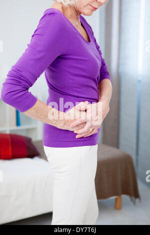 Hip pain in an elderly person Stock Photo