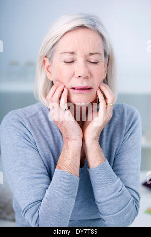 Elderly person with a toothache Stock Photo