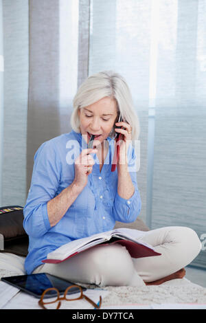 Elderly person on the phone Stock Photo