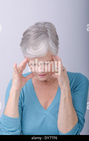 Elderly person with headache Stock Photo