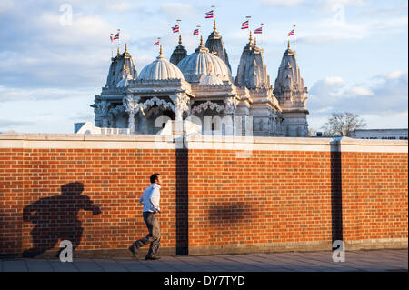 London, UK. 8th April, 2014. A man arrives at The BAPS Shri Swaminarayan Mandir, also referred to as Neasden Temple, before the celebrations of Swaminarayan Jayanti at Neasden Temple in London. Credit:  Piero Cruciatti/Alamy Live News Stock Photo