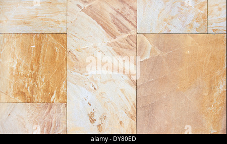 Wall from stone tiles with natural pattern. Stone tiles with natural pattern. Stock Photo