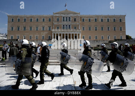 Athens, Greece. 09th Apr, 2014. Riot police officers walks in front of the Greek Parliament during massive anti-austerity demonstrations in Athens, Greece on April 9, 2014. Greek unions launched an anti-austerity general strike that halted train and island ferry services while disrupting state hospitals and other public services. Thousands of protesters marched through central Athens. Credit:  Konstantinos Tsakalidis/Alamy Live News Stock Photo