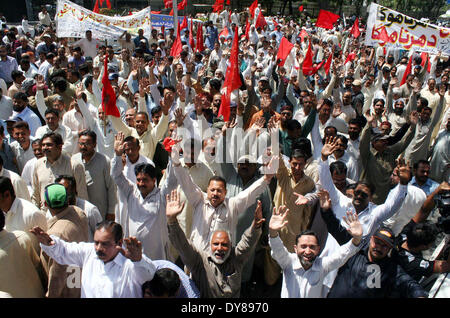 Members of Wapda Hydro Electric Central Labour Union chant slogans against privatization of Water and Power Development Authority (WAPDA) during protest demonstration at Mall road in Lahore on Wednesday, April 09, 2014. Stock Photo