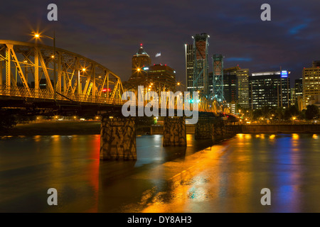 Downtown Portland, Oregon reflects off the Willamette River in the early evening of summer. USA Stock Photo