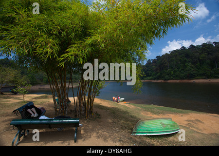 The serene lake at Gavi and beautiful Periyar reserve in the backdrop Stock Photo