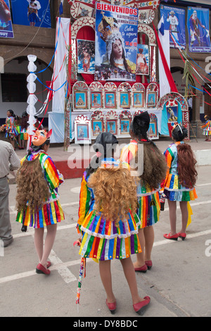 South America, Peru, Calca, costumed dancers in front of stage at Assumption of the Virgin festival in August Stock Photo