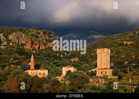 The church of Agios Spyridon and the tower of Mourtzinos in Palia ('Old') Kardamyli, Mani, Messenia, Peloponnese, Greece. Stock Photo