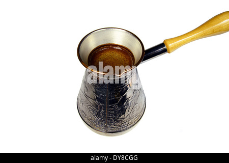 turkish coffee brewing pot isolated on white Stock Photo