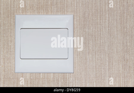 Single large light switch in beige color wall Stock Photo