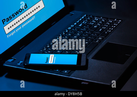 Hacker using laptop. Lots of digits on the computer screen. Stock Photo
