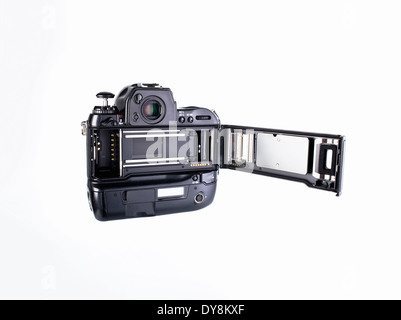 The back of a professional 35mm film camera with film loading door open to show film compartment and shutter Stock Photo