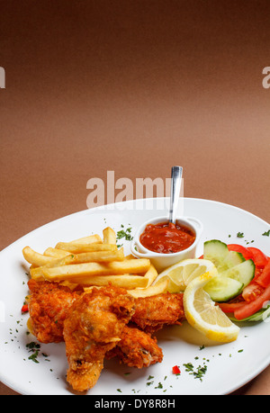 Fried chicken legs with french fries Stock Photo