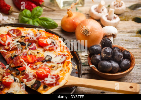 Fresh italian homemade pizza in metal plate Stock Photo