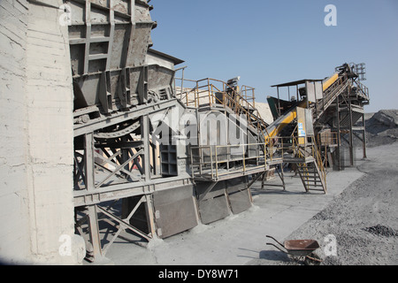 A stone crushing and grading machine operating in metals waste recovery plant in Bahrain Stock Photo