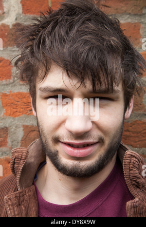 Model released close up portrait of 20 year old man with beard, UK Stock Photo