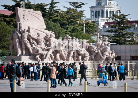 Stone revolutionary monument in front of Mausoleum of Mao Zedong at Tiananmen Square in Beijing, China Stock Photo