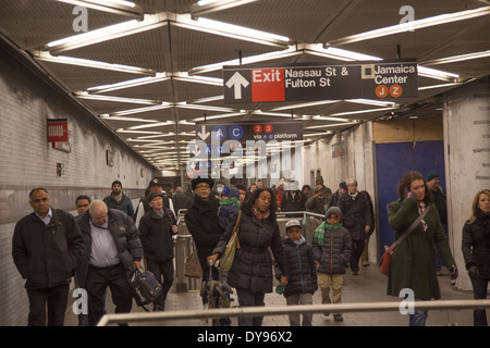 Riders in the Fulton Street subway station in lower Manhattan's financial district. Stock Photo