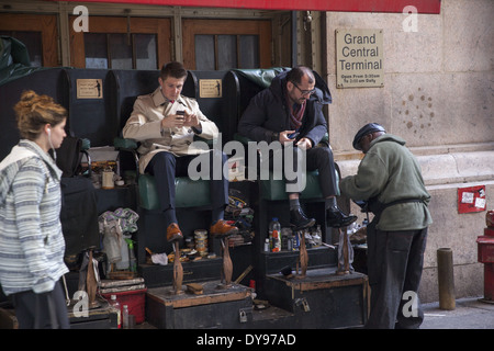 Small shoeshine business on the sidewalk outside Grand Central Terminal on 42nd St. in NYC. Stock Photo