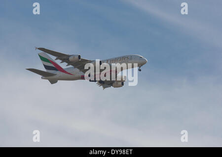 Loch Ardinning, Strathblane, Glasgow, Scotland, UK. 10th April 2014. Emirates Airbus A380 flies over the Campsie Fells on it's approach to Glasgow airport for it's first visit to Scotland Credit:  Paul Stewart/Alamy Live News Stock Photo