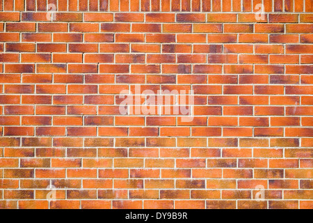 Plain flat brick wall background made of red bricks and mortar. UK Britain Stock Photo