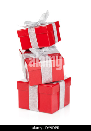 Three red gift boxes with silver ribbon and bow. Isolated on white background Stock Photo