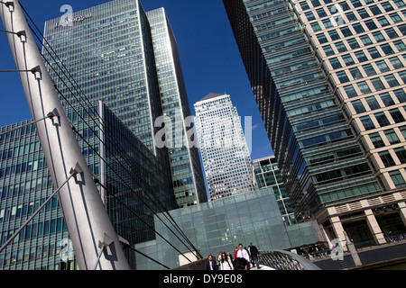 UK, London : Pedestrians cross a bridge near the offices of JPMorgan Chase & Co. in  Canary Wharf  on 10 April, 2014. Stock Photo