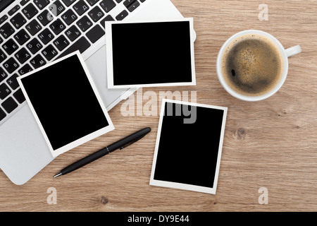 Blank instant photo frames over office table. View from above Stock Photo