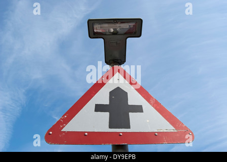 british road sign indicating a crossroads junction ahead, in barnes, southwest london, engand Stock Photo