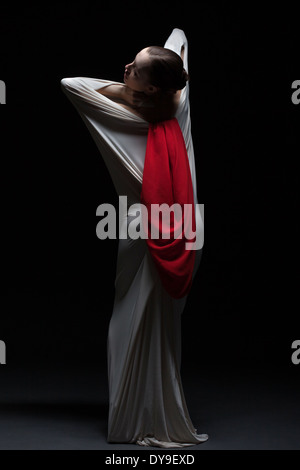Artistic female dancer posing back to camera Stock Photo