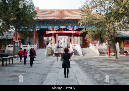 statue of Confucius in front of Dacheng Gate in The Temple of Confucius at Guozijian Street in Beijing, China Stock Photo