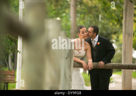Engaged couple kissing after wedding Stock Photo