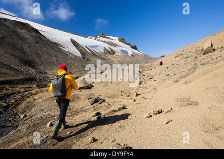 Passengers on an expedition cruise climbing the caldera on Deception Island in the South Shetland Islands Stock Photo