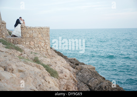 Engaged couple kissing after wedding Stock Photo