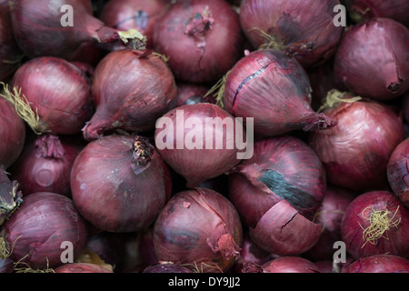 Red onions on display in a supermarket Stock Photo