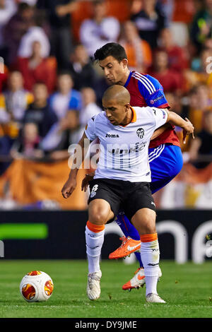 Valencia, Spain. 10th Apr, 2014. Sophian FEGHOULI (DOWN) is challenged by Defender Fabian Schar of FC Basel during the Europa League Game between Valencia CF and FC Basel at Mestalla Stadium, Valencia Credit:  Action Plus Sports/Alamy Live News Stock Photo