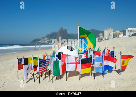 International football country flags with soccer ball on Ipanema beach in Rio de Janeiro Brazil Stock Photo