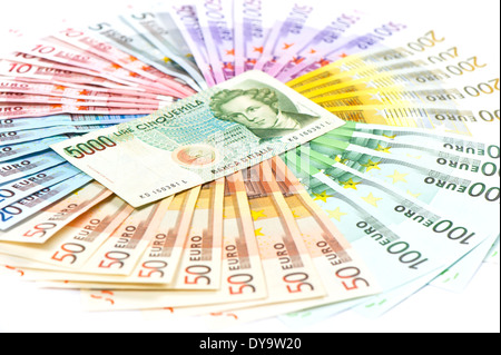 old italian lire (its no existing money) over euro currency banknotes. euro crisis concept Stock Photo