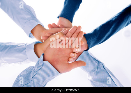 Close up view of hands getting together  on white background Stock Photo
