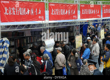 Beijing, China. 11th Apr, 2014. Readers select books during 2014 Beijing Book Fair at the Chaoyang Park in Beijing, capital of China, April 11, 2014. The Beijing Book Fair, which kicked off on April 11, will last until April 20. © Zhao Bing/Xinhua/Alamy Live News Stock Photo