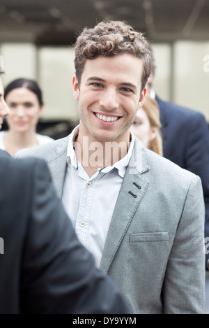 Young business associate with colleagues Stock Photo