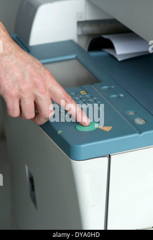 Using photocopier, close-up Stock Photo