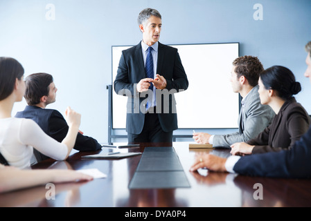 Executive making presentation at business meeting Stock Photo