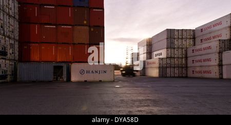 Red Moving Containers Container handling vehicle moving white container at port Stock Photo ...