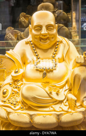 China, Macau, Gold and Jewellery Shop Window, Display of Gold Buddha Statue Stock Photo