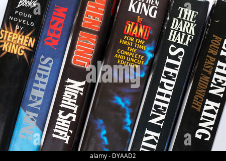row of Stephen King books including Four Past Midnight, The Dark Half, the Stand, Night Shift, Misery and Four Novels by Stephen King Stock Photo