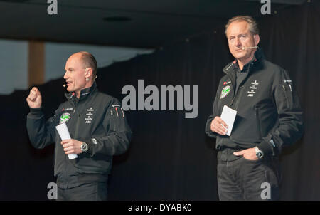 Payerne, Switzerland. 09th Apr, 2014. Bertrand Piccard (left) and Andre Borschberg at the unveiling of 'Solar Impulse 2', a spectacular solar powered aircraft made to fly around the world without any fuel. Credit:  Erik Tham/Alamy Live News Stock Photo