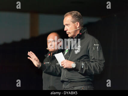 Payerne, Switzerland. 09th Apr, 2014. Andre Borschberg (right) and Bertrand Piccard on stage at the unveiling of 'Solar Impulse 2', a spectacular solar powered aircraft made to fly around the world without any fuel. Credit:  Erik Tham/Alamy Live News Stock Photo